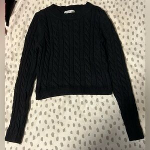 Black knitted sweater small cropped.